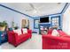 The bright living room features fresh paint, tile flooring, and large windows at 1308 Edgewood Rd, Charlotte, NC 28208