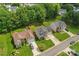 Aerial view of a home with well-maintained lawns, lush landscaping, and a serene residential setting at 13430 Norseman Ln, Huntersville, NC 28078