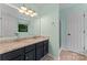 Bathroom with double sinks, granite countertops, a large mirror and ample lighting at 13430 Norseman Ln, Huntersville, NC 28078