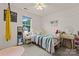 This well-lit bedroom features plush carpet, plenty of decor and a bright window at 13430 Norseman Ln, Huntersville, NC 28078