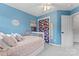 This bedroom offers natural light and closet with a bright floral print at 13430 Norseman Ln, Huntersville, NC 28078