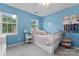 This bedroom offers a beautiful window view, plush carpet, and a cute theme at 13430 Norseman Ln, Huntersville, NC 28078