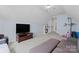This bonus room features plenty of carpeted space for leisure or entertaining at 13430 Norseman Ln, Huntersville, NC 28078