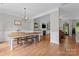 Dining room with a large table, stylish light fixture, and seamless access to living areas at 13430 Norseman Ln, Huntersville, NC 28078