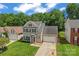 Charming two-story home with a well-maintained lawn, inviting curb appeal, and a classic architectural style at 13430 Norseman Ln, Huntersville, NC 28078