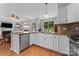 Bright kitchen with granite countertops, stainless steel appliances, and an open layout for easy entertaining at 13430 Norseman Ln, Huntersville, NC 28078