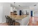 A kitchen featuring granite countertops, wooden floors, stainless appliances, and a breakfast bar at 13430 Norseman Ln, Huntersville, NC 28078