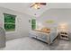 Bright bedroom with vaulted ceilings, large windows and soft, neutral tones at 13430 Norseman Ln, Huntersville, NC 28078