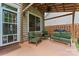 This covered outdoor patio provides the perfect spot for relaxation and backyard barbecues at 13430 Norseman Ln, Huntersville, NC 28078