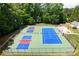 An aerial view of well-maintained community tennis courts surrounded by lush trees and greenery at 13430 Norseman Ln, Huntersville, NC 28078
