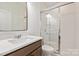 Modern bathroom featuring a glass enclosed shower with white subway tile and a vanity with sink at 1381 Regions Blvd, Fort Mill, SC 29707