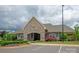 Attractive clubhouse with a stone facade and landscaping, providing a welcoming community gathering space at 1381 Regions Blvd, Fort Mill, SC 29707