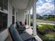 Inviting front porch with rocking chairs, offering a relaxing outdoor space to enjoy the neighborhood views at 1381 Regions Blvd, Fort Mill, SC 29707