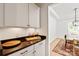 Convenient kitchenette space showcasing elegant cabinetry and granite countertops near the dining room at 1381 Regions Blvd, Fort Mill, SC 29707