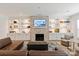 Cozy living room with brick fireplace, custom shelves, and a comfortable seating area at 1381 Regions Blvd, Fort Mill, SC 29707