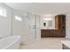 Spacious bathroom with modern fixtures, a glass-enclosed shower, and a freestanding bathtub at 1381 Regions Blvd, Fort Mill, SC 29707