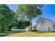 Enjoy a spacious backyard, perfect for outdoor activities and relaxation surrounded by mature trees at 139 Elysian Dr, Mooresville, NC 28117