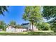 A spacious backyard and deck area, surrounded by lush greenery and mature trees at 139 Elysian Dr, Mooresville, NC 28117