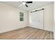 Charming bedroom featuring light-filled windows and a stylish sliding barn door for a closet at 139 Elysian Dr, Mooresville, NC 28117