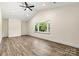 Spacious bedroom boasts high ceilings, lots of natural light, and hardwood floors at 139 Elysian Dr, Mooresville, NC 28117