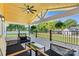Cozy covered porch with comfortable seating, ceiling fan, and views of the front yard at 139 Elysian Dr, Mooresville, NC 28117