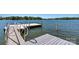Modern dock featuring gray decking and metal railings, perfect for enjoying waterfront living at 139 Elysian Dr, Mooresville, NC 28117