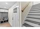 Entryway with stairs features built-in mudroom bench with storage and access to the outdoors at 139 Elysian Dr, Mooresville, NC 28117