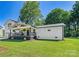 Beautiful house exterior with a stylish porch, manicured lawn, and a detached garage at 139 Elysian Dr, Mooresville, NC 28117