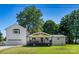 Charming home with a welcoming front porch, white brick accents, and a well-maintained lawn at 139 Elysian Dr, Mooresville, NC 28117