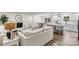 Bright, open-concept living room with a fireplace, dining area, and modern kitchen at 139 Elysian Dr, Mooresville, NC 28117