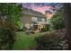 Spacious backyard with an outdoor dining and lounge area at 15247 Prescott Hill Ave, Charlotte, NC 28277