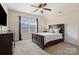 Comfortable bedroom featuring a large bed, dresser, natural light, and neutral décor at 15247 Prescott Hill Ave, Charlotte, NC 28277