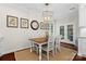 Dining room showcases an elegant chandelier and access to the outdoors via a set of french doors at 15247 Prescott Hill Ave, Charlotte, NC 28277
