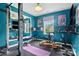 Bright exercise room with gym equipment, large mirrors, and natural light from the windows at 15247 Prescott Hill Ave, Charlotte, NC 28277