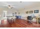 Spacious game room with hardwood floors, foosball table, ping pong table, and a desk at 15247 Prescott Hill Ave, Charlotte, NC 28277
