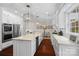 Open-concept kitchen featuring an island with seating, stainless appliances, and granite countertops at 15247 Prescott Hill Ave, Charlotte, NC 28277