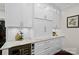 White kitchen cabinets with granite countertops and a built-in wine cooler at 15247 Prescott Hill Ave, Charlotte, NC 28277
