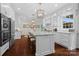 Bright kitchen with a large island, granite countertops, and modern stainless steel appliances at 15247 Prescott Hill Ave, Charlotte, NC 28277