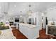 Open kitchen with a large island, stainless appliances, and access to the living area at 15247 Prescott Hill Ave, Charlotte, NC 28277