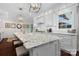 Close up of the kitchen island with granite countertops and stylish pendant lighting at 15247 Prescott Hill Ave, Charlotte, NC 28277