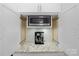 Appliance garage features a microwave and coffee maker nestled among sleek white cabinets and granite countertops at 15247 Prescott Hill Ave, Charlotte, NC 28277