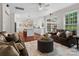 Open-concept living room flowing into a bright kitchen with a large island, perfect for entertaining at 15247 Prescott Hill Ave, Charlotte, NC 28277