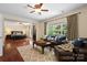 Inviting living room with hardwood floors, plush seating, and large windows offering great natural light at 15247 Prescott Hill Ave, Charlotte, NC 28277