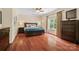 Spacious bedroom features hardwood floors, a large window, and comfortable seating at 15247 Prescott Hill Ave, Charlotte, NC 28277