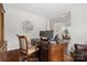 Spacious home office with a wooden desk, comfortable chair, and hardwood flooring at 15247 Prescott Hill Ave, Charlotte, NC 28277