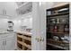 Walk-in pantry with wooden shelves showcases ample storage space and well-organized kitchen appliances at 15247 Prescott Hill Ave, Charlotte, NC 28277