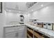 Bright pantry with sleek white cabinets, granite countertops and open shelving offers plenty of storage at 15247 Prescott Hill Ave, Charlotte, NC 28277