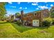 Charming brick home featuring a back deck, screened porch, and a spacious backyard at 157 E Meadowview Dr, Statesville, NC 28625