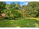 An exterior view shows a barn and shed, with plenty of room for recreation at 157 E Meadowview Dr, Statesville, NC 28625