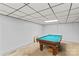 Spacious unfinished basement with a pool table and concrete flooring at 157 E Meadowview Dr, Statesville, NC 28625